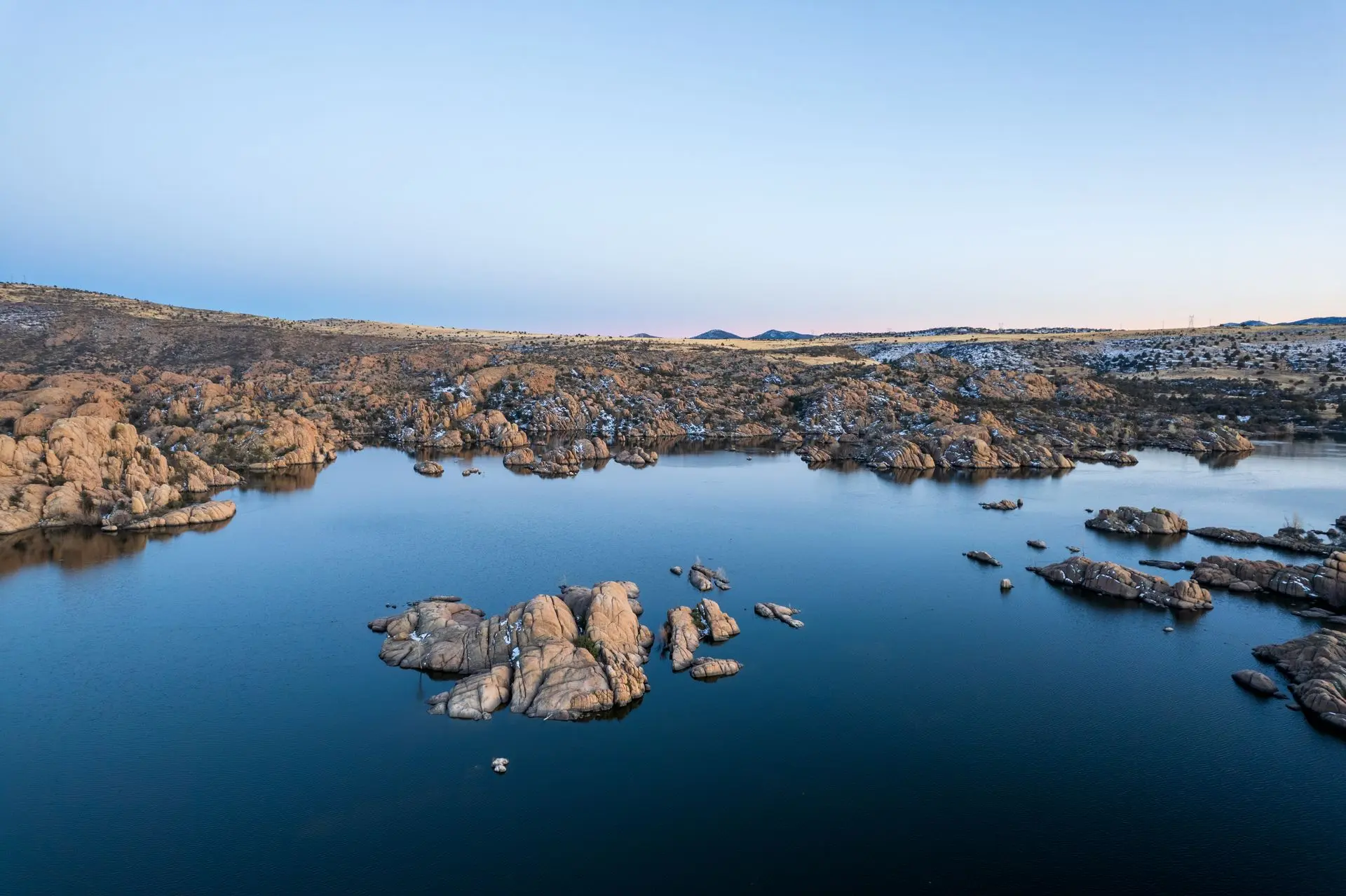Rock formations rising above a lake in Northern Arizona